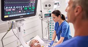 medical practitioner using an ifusion pump on a patient