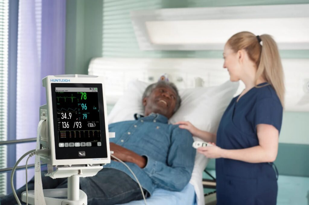 modern patient monitoring device displaying vital signs