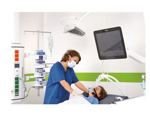Nurse adjusting LED examination light